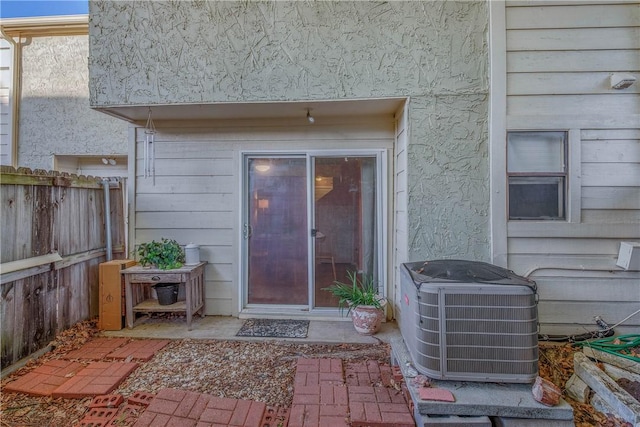 doorway to property featuring central AC unit