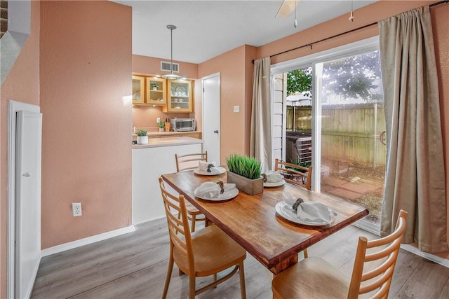 dining space featuring light hardwood / wood-style flooring