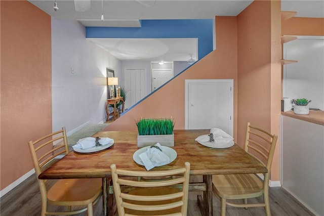 dining space featuring dark hardwood / wood-style floors