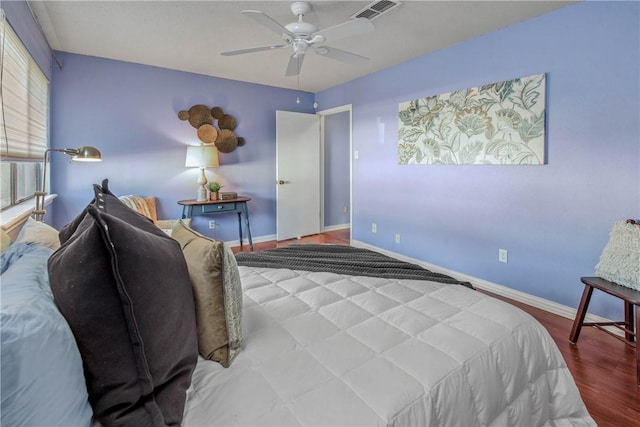 bedroom with ceiling fan and wood-type flooring