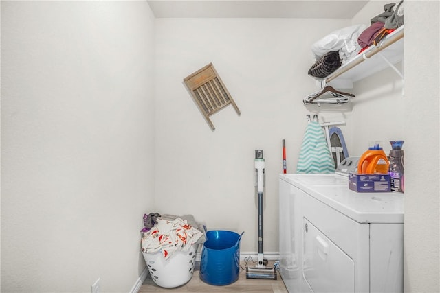 1946 Thorndyke Ln, Bryan, TX 77807 - washroom with washer and clothes dryer and baseboards
