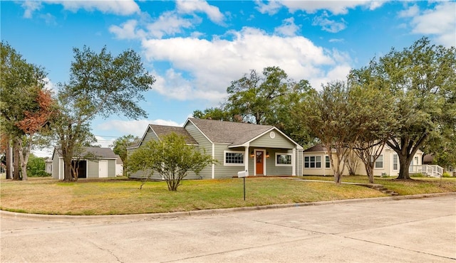 view of front facade with a front yard and a storage unit