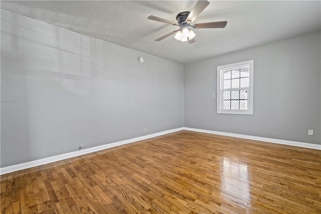 unfurnished room featuring ceiling fan and hardwood / wood-style floors