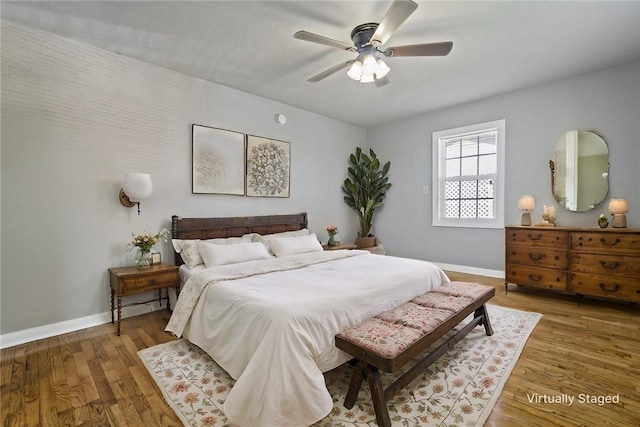 bedroom featuring ceiling fan and wood-type flooring