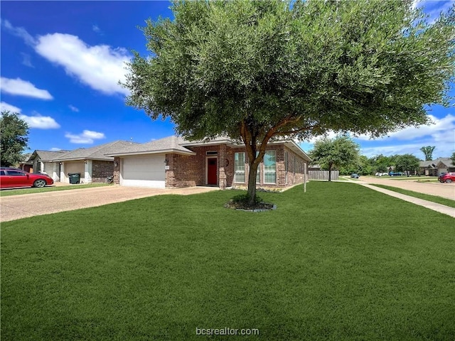 view of front of house with a garage and a front lawn