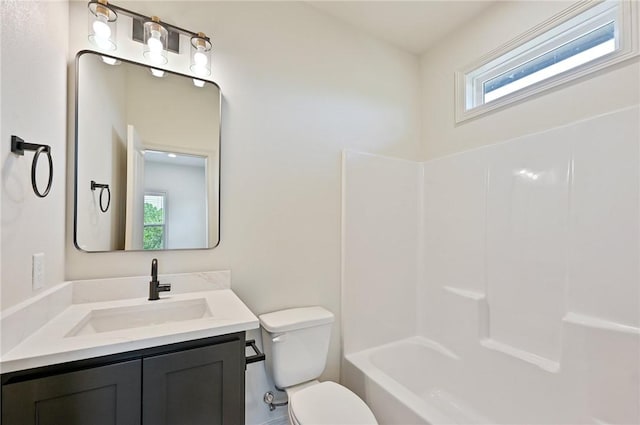 full bathroom featuring vanity, shower / bath combination, and toilet