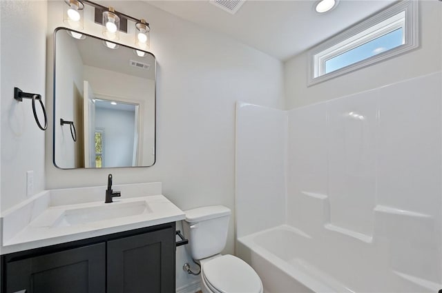 full bathroom featuring bathing tub / shower combination, vanity, and toilet