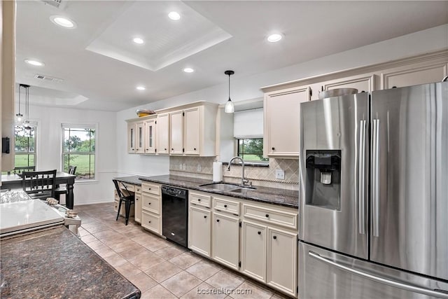 kitchen with sink, hanging light fixtures, black dishwasher, stainless steel fridge with ice dispenser, and cream cabinets