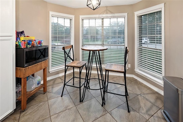 tiled dining space with baseboards
