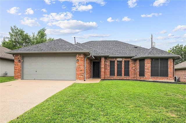 view of front facade featuring brick siding, a front yard, driveway, roof with shingles, and an attached garage