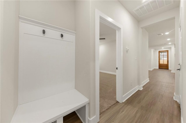 mudroom with hardwood / wood-style floors