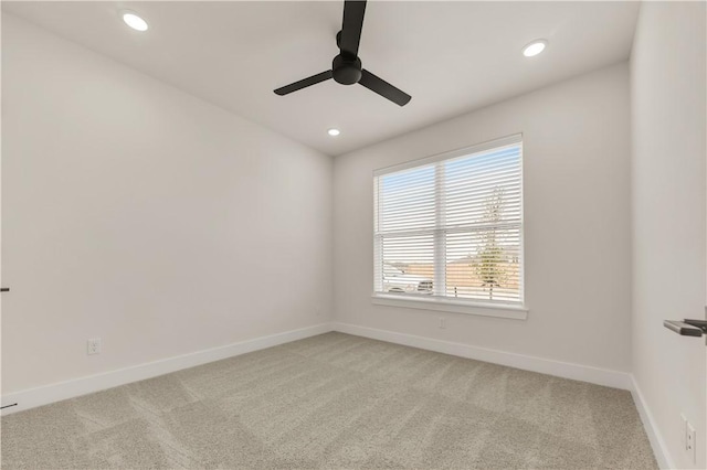 spare room with ceiling fan and carpet flooring