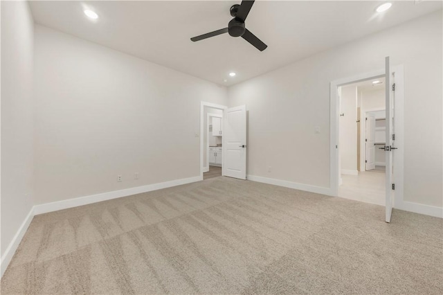 unfurnished bedroom featuring ceiling fan and light carpet