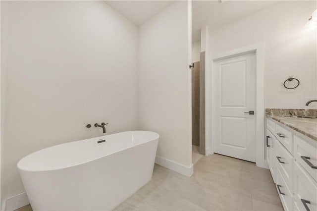 bathroom with vanity and shower with separate bathtub