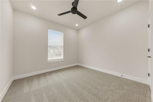 unfurnished room featuring ceiling fan and carpet