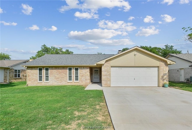 single story home featuring a garage and a front lawn