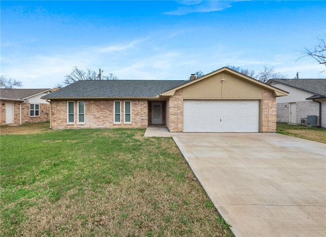 single story home with a garage and a front lawn