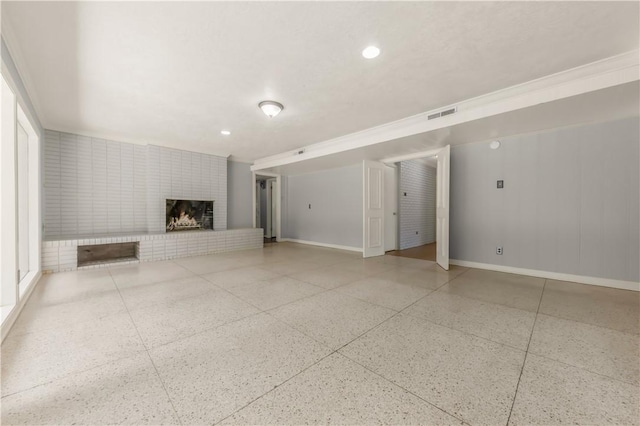 714 S Rosemary Dr, Bryan, TX 77802 - unfurnished living room featuring a brick fireplace and recessed lighting