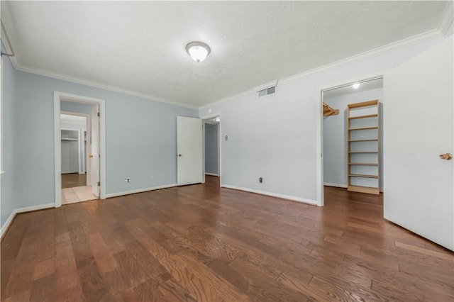 714 S Rosemary Dr, Bryan, TX 77802 - spare room featuring ornamental molding and wood finished floors