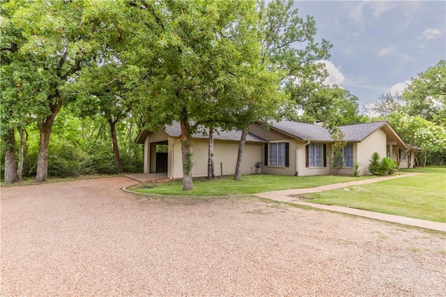 714 S Rosemary Dr, Bryan, TX 77802 - view of front of home with driveway, a front yard, and a garage