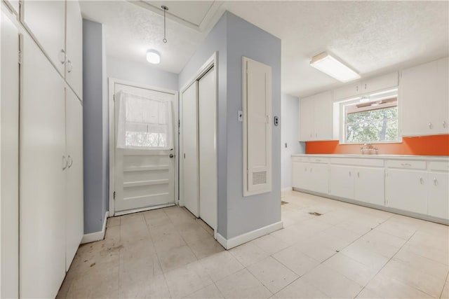 714 S Rosemary Dr, Bryan, TX 77802 - kitchen with white cabinets and light countertops