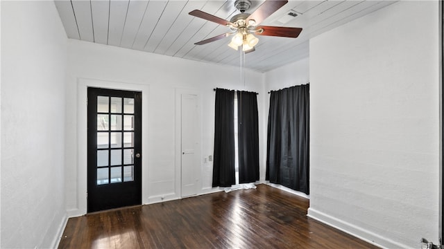 foyer featuring a ceiling fan, hardwood / wood-style floors, baseboards, and wooden ceiling