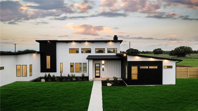 view of front of home with a lawn