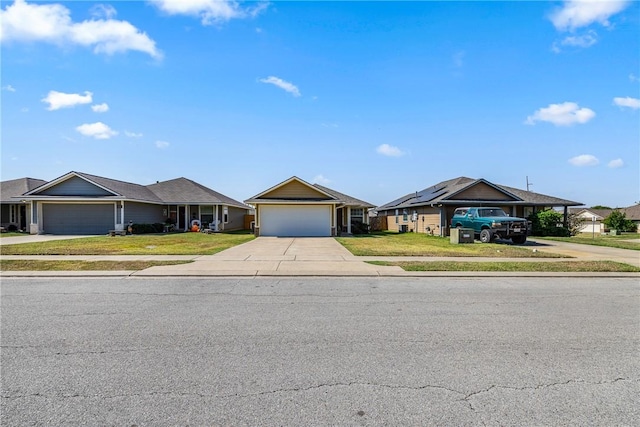 single story home featuring a garage and a front lawn