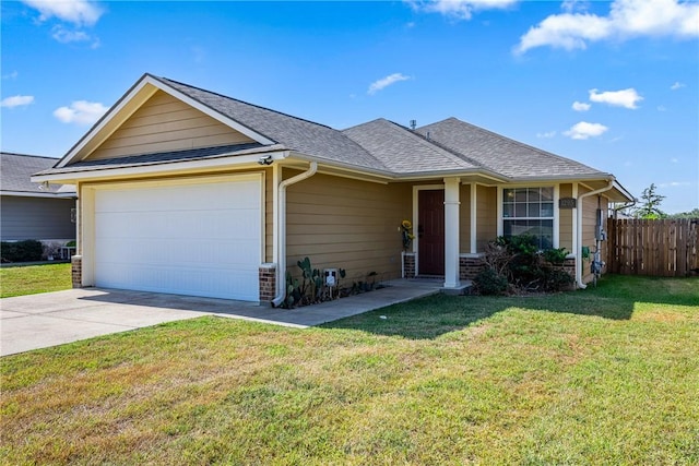 ranch-style home with a garage and a front lawn