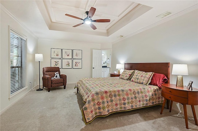 bedroom featuring ceiling fan, ornamental molding, light colored carpet, and a raised ceiling