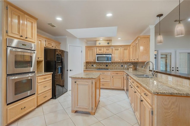 kitchen with backsplash, a center island, sink, hanging light fixtures, and appliances with stainless steel finishes