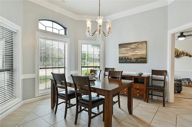 tiled dining space with crown molding and a chandelier