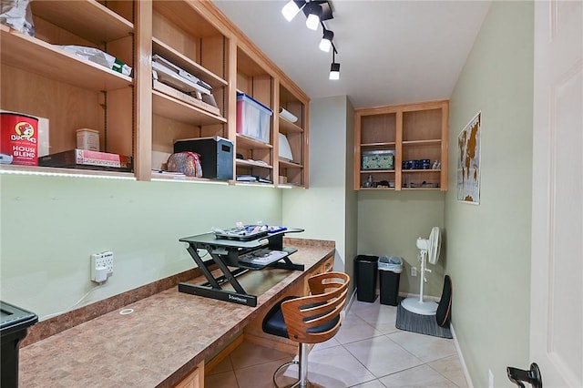 home office featuring rail lighting and light tile patterned floors