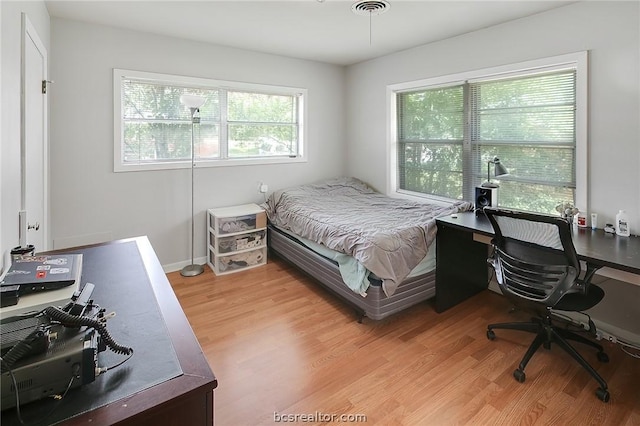 bedroom featuring light wood-type flooring