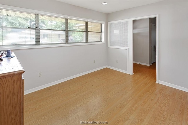 unfurnished bedroom featuring a closet and light hardwood / wood-style flooring