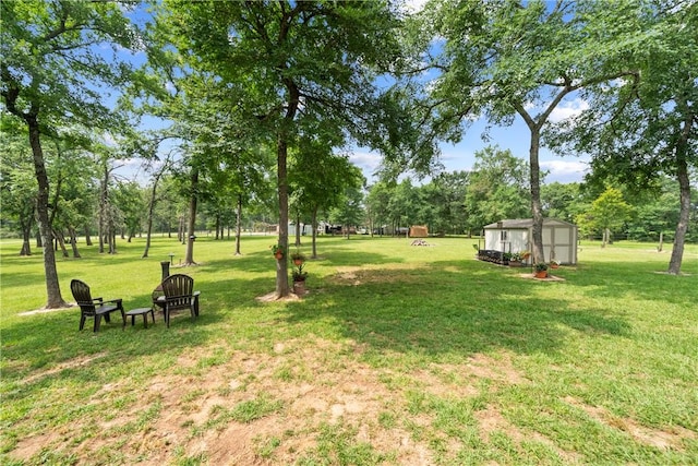 32041 Fm 1736th Rd, Hempstead, TX 77445 - view of green lawn featuring view of wooded area