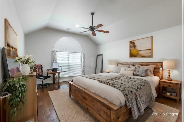 bedroom featuring lofted ceiling, dark hardwood / wood-style flooring, and ceiling fan