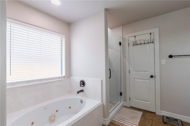 bathroom featuring separate shower and tub