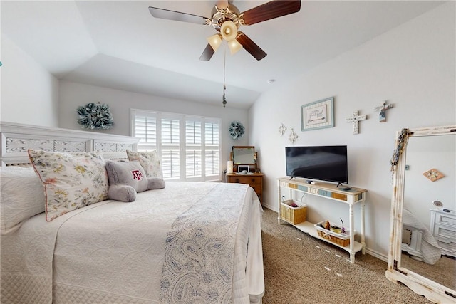 bedroom with ceiling fan, carpet flooring, and vaulted ceiling