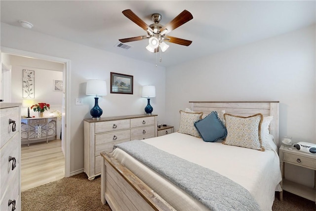 carpeted bedroom with ceiling fan