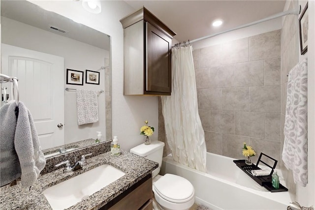 full bathroom featuring toilet, shower / tub combo, and vanity