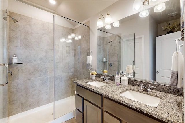 bathroom featuring vanity, vaulted ceiling, and a shower with door