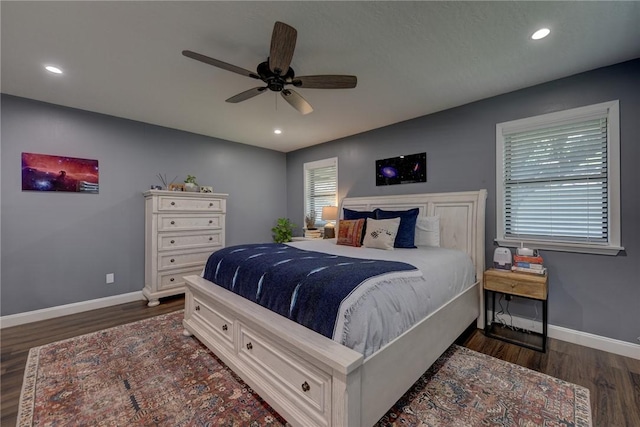 1600 Pecan St, Brenham, TX 77833 - bedroom featuring baseboards, dark wood-type flooring, recessed lighting, and a ceiling fan