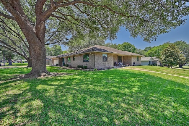 1600 Pecan St, Brenham, TX 77833 - ranch-style home featuring a front lawn and brick siding