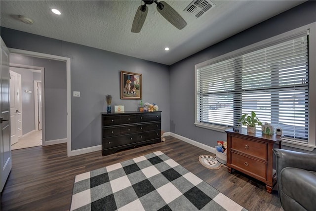 1600 Pecan St, Brenham, TX 77833 - sitting room with dark wood finished floors, ceiling fan, baseboards, a textured ceiling, and recessed lighting