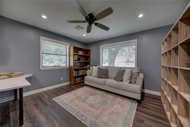 1600 Pecan St, Brenham, TX 77833 - living room featuring healthy amount of natural light, dark wood finished floors, a ceiling fan, and recessed lighting