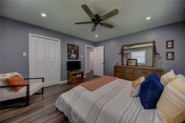 1600 Pecan St, Brenham, TX 77833 - bedroom with dark wood-style floors, a textured ceiling, recessed lighting, a closet, and ceiling fan