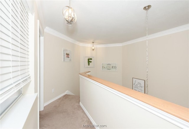 corridor with light colored carpet and ornamental molding