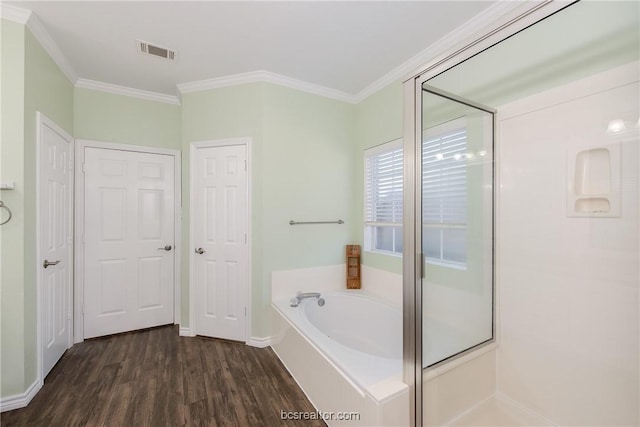 bathroom featuring hardwood / wood-style floors, shower with separate bathtub, and crown molding