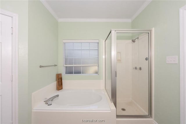 bathroom with crown molding and shower with separate bathtub